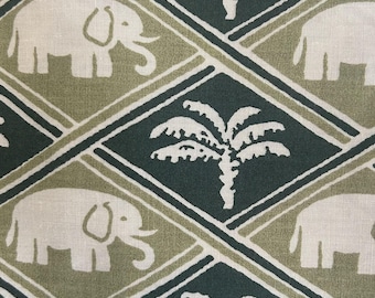 May include: A fabric pattern featuring a repeating diamond grid design. The print displays alternating white elephants and white palm trees set against a background of dark forest green and muted olive green diamond-shaped sections.