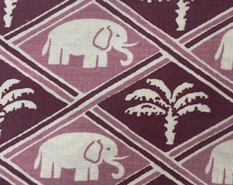 May include: A fabric textile featuring a repeating diamond grid pattern in shades of deep plum and light mauve. The design alternates between white silhouettes of elephants and white silhouettes of palm trees centered within each diamond shape.