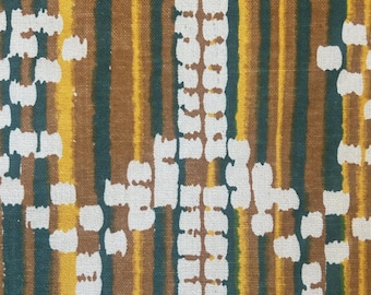 May include: A textile fabric featuring a vertical striped pattern in shades of dark green, brown, and yellow. The design is overlaid with a repeating geometric motif composed of small, white, square-shaped marks that create a textured appearance.