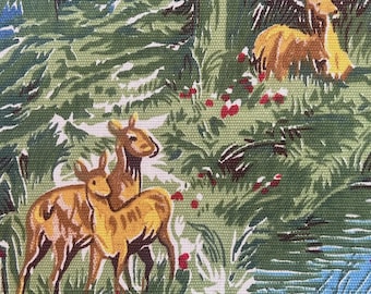 May include: A woven fabric featuring a printed pattern of golden-brown deer standing in a lush green forest. The scene includes dense foliage, tall trees, and small red berries scattered throughout the landscape, with a blue stream at the bottom.
