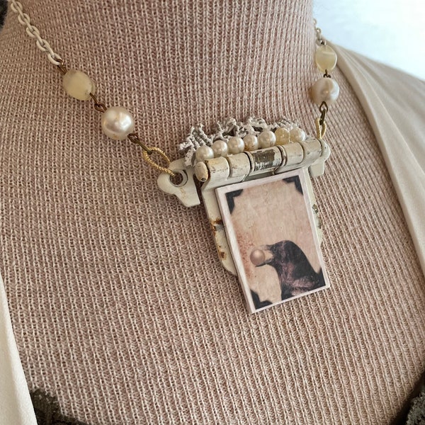 Assemblage hinge necklace with pearls and creamy tones.