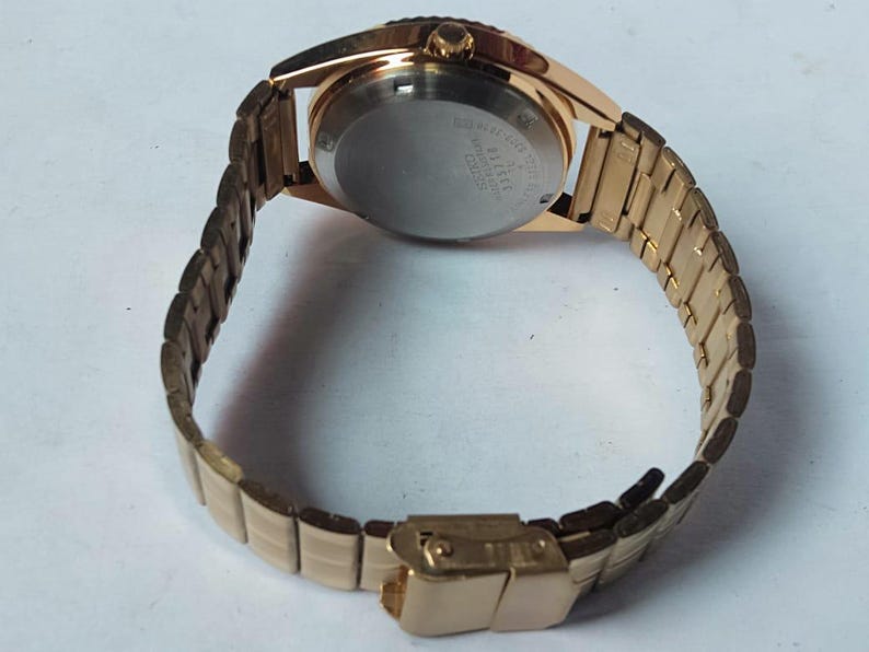 Vintage Seiko 5 Automatic Watch: Gold Dial, Japan Made, Day/Date image 9