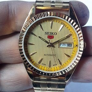 Vintage Seiko 5 Automatic Watch: Gold Dial, Japan Made, Day/Date image 2