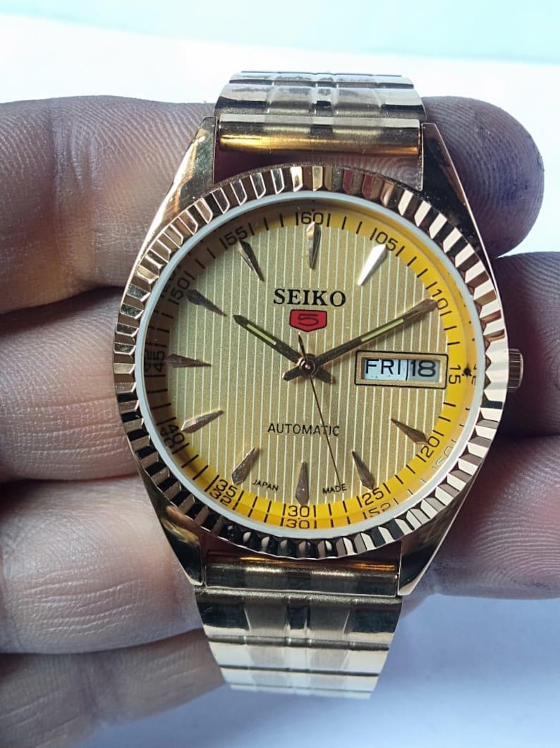 Vintage Seiko 5 Automatic Watch: Gold Dial, Japan Made, Day/Date image 2