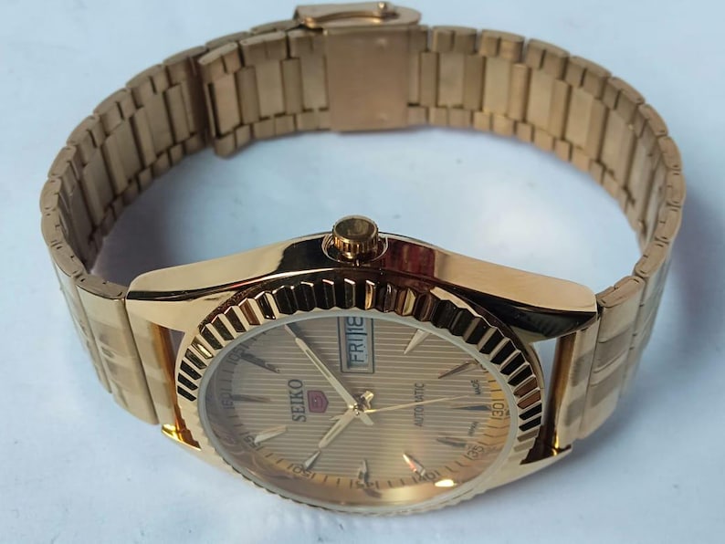 Vintage Seiko 5 Automatic Watch: Gold Dial, Japan Made, Day/Date image 3