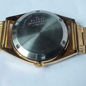 Vintage Seiko 5 Automatic Watch: Gold Dial, Japan Made, Day/Date image 7