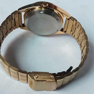Vintage Seiko 5 Automatic Watch: Gold Dial, Japan Made, Day/Date image 8