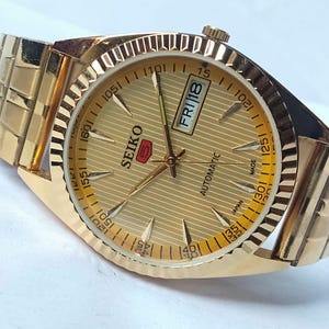 Vintage Seiko 5 Automatic Watch: Gold Dial, Japan Made, Day/Date image 6