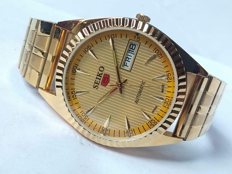 Vintage Seiko 5 Automatic Watch: Gold Dial, Japan Made, Day/Date image 6