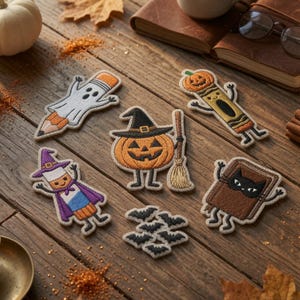 May include: A collection of six embroidered patches featuring Halloween themes: a ghost pencil, a pumpkin crayon, a jack-o'-lantern with a broom, a character in a purple cape and hat, a brown book with a black cat face, and a cluster of small black bats.