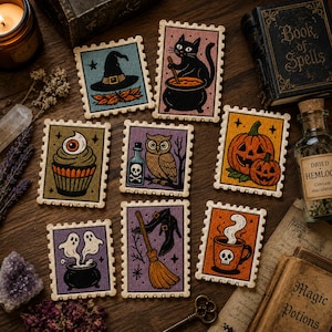 May include: A set of eight rectangular embroidered patches with scalloped edges, featuring Halloween-themed illustrations including a witch hat, a black cat with a cauldron, a cupcake with an eye, an owl, pumpkins, ghosts, a broom, and a skull mug.