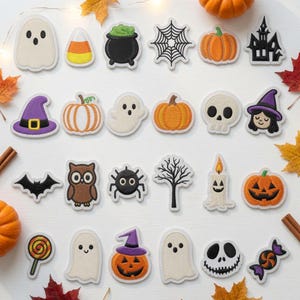 May include: A collection of embroidered Halloween-themed patches featuring various designs including ghosts, pumpkins, a black cauldron, a spider web, a skull, a witch hat, a bat, an owl, a spider, a bare tree, a candle, a jack-o'-lantern, and candy.