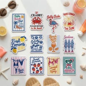 May include: A collection of twelve rectangular and shaped vinyl stickers featuring beach-themed illustrations and text including Palm Beach Club, If Crabby Please Return to the Beach, Salty Babe, Here Comes The Sun, Fresh Lemons, Salty Soul, Beach Spritz Club, Sardines, Beach Bum, Sweet Summer, Tanned and Tipsy, and Margaritas Made We Do It.