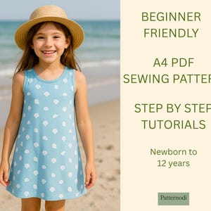 Girl in seashell print blue kids a line dress on beach, beginner friendly A4 PDF sewing pattern promo