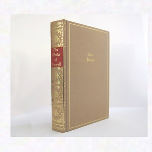 May include: A brown book with gold lettering on the spine. The title is "The Works of Boswell" and the author is "James Boswell".
