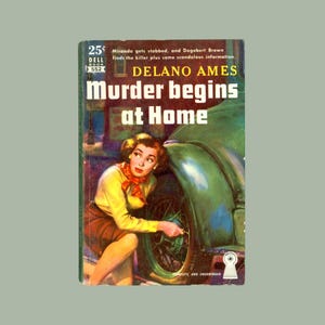 May include: Vintage paperback book cover titled "Murder Begins at Home" by Delano Ames. The cover art features a woman in a yellow blouse and brown skirt kneeling by a green car. The book is a Dell Book, priced at 25¢.