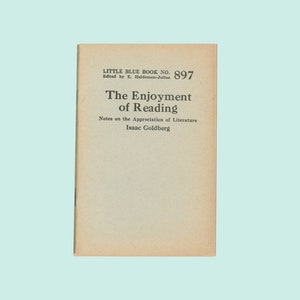May include: A vintage book cover with the title "The Enjoyment of Reading" by Isaac Goldberg. The book is part of the Little Blue Book series, number 897.