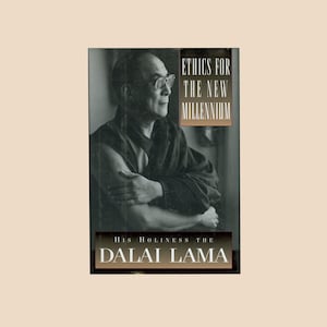 May include: A black and white photo of the Dalai Lama on the cover of his book "Ethics for the New Millennium".