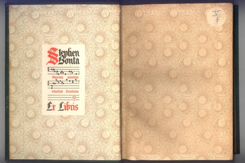 May include: Open book with decorative patterned pages. The left page features a printed label with the name "Stephen Bonta" in red and black, along with musical notation and the words "Ex Libris". The right page has a circular pattern.