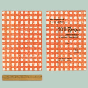 May include: A red and white checkered cookbook cover with the title "100 Recipes for your new Automatic Skillet, Casserole, Chafing Dish" and the text "Kitchen-tested Flavor-perfect... from lovingly prepared "different" dishes"