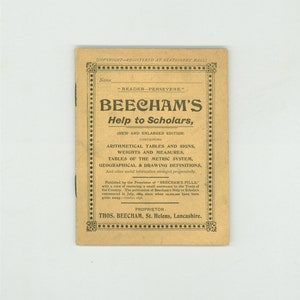 May include: A vintage book cover for "Beecham's Help to Scholars" with a yellow background and black text. The book is a new and enlarged edition containing arithmetic tables, weights and measures, tables of the metric system, geographical and drawing definitions. The book was published by the proprietor of "Beecham's Pills" to assist youth in the country.