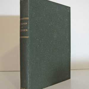 May include: A hardcover book with a dark green cover and spine. The spine features gold lettering that reads "Beethoven - Studien". The book is standing upright on a white surface.