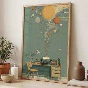 May include: A framed art print featuring a whimsical illustration of a desk with a typewriter, lamp, and books. The artwork depicts a surreal scene with floating planets and a stream of colorful elements rising from the typewriter, set against a teal background.