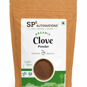 May include: A brown paper pouch containing organic clove powder. The white label features the text SP AUTOMATIONS, PURE | NATURAL | TRUSTED, ORGANIC Clove Powder, PREMIUM QUALITY, and Certified Organic. A circular window reveals the dark brown powder.