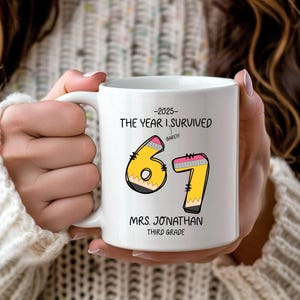 May include: White ceramic mug with the text "-2025- THE YEAR I SURVIVED" and the numbers "67" designed as pencils. The mug also includes the text "MRS. JONATHAN THIRD GRADE".