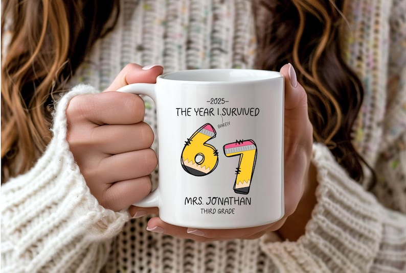 May include: White ceramic mug with the text "-2025- THE YEAR I SURVIVED" and the numbers "67" designed as pencils. The mug also includes the text "MRS. JONATHAN THIRD GRADE".