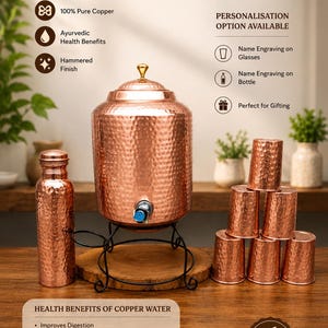 May include: A copper water dispenser set featuring a large hammered copper container with a spigot, a matching bottle, and six hammered copper tumblers. The set includes text detailing health benefits, personalisation options, and pure copper composition.