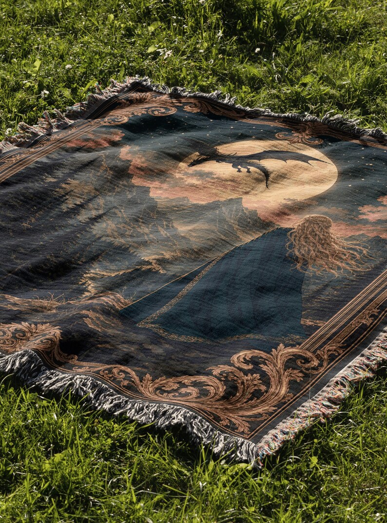 Dark teal woven textile with brown and gold swirling abstract pattern and fringed edge.