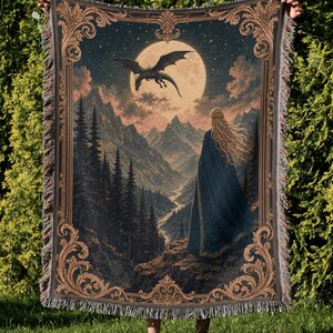 Tapestry depicting a woman, dragon, moon, and mountains with ornate border.