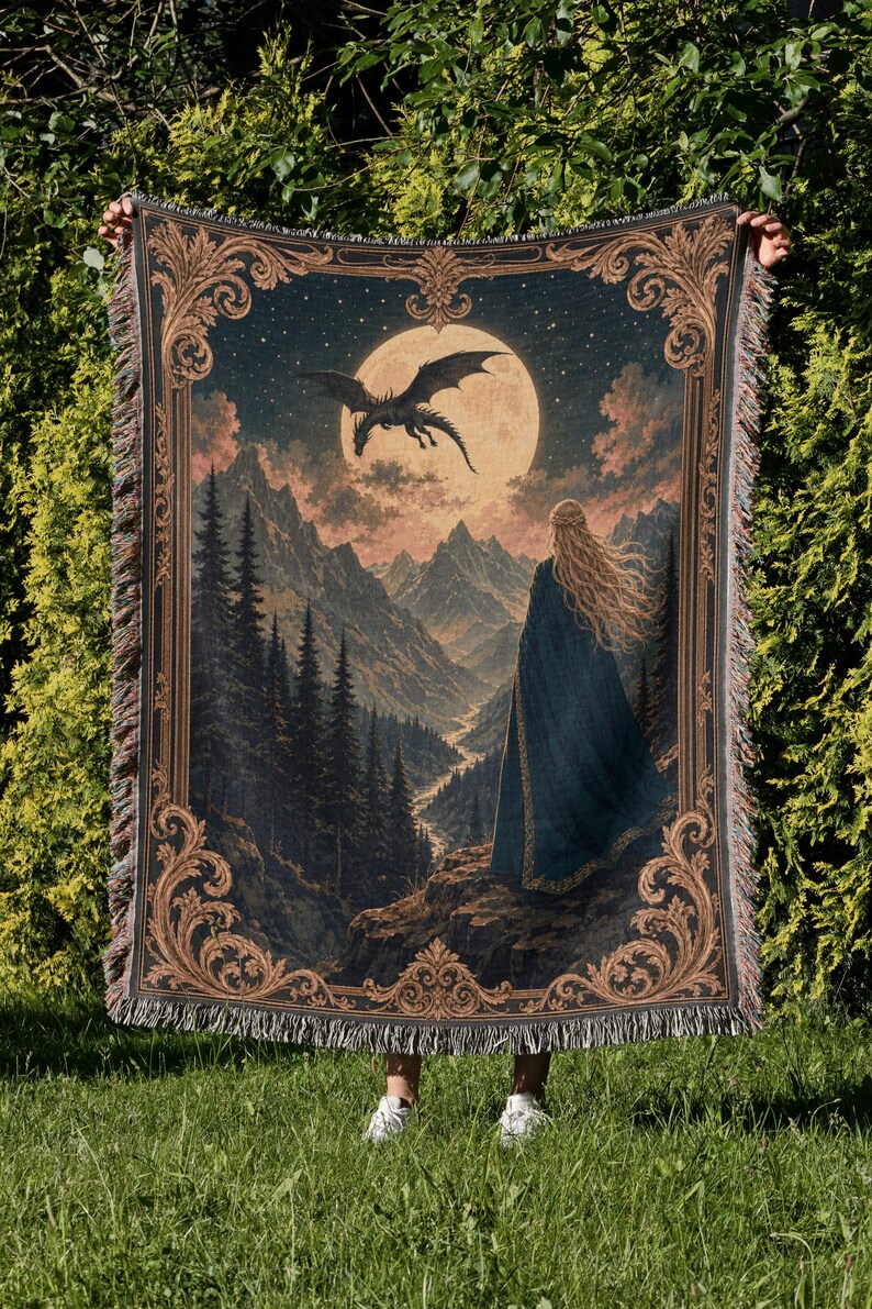 Tapestry depicting a woman, dragon, moon, and mountains with ornate border.