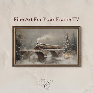 May include: A framed painting of a vintage train crossing a stone bridge in a snowy landscape. The artwork features a steam engine with passenger cars, set against a backdrop of snow-covered trees and a cloudy sky. The text "Fine Art For Your Frame TV" is at the top.