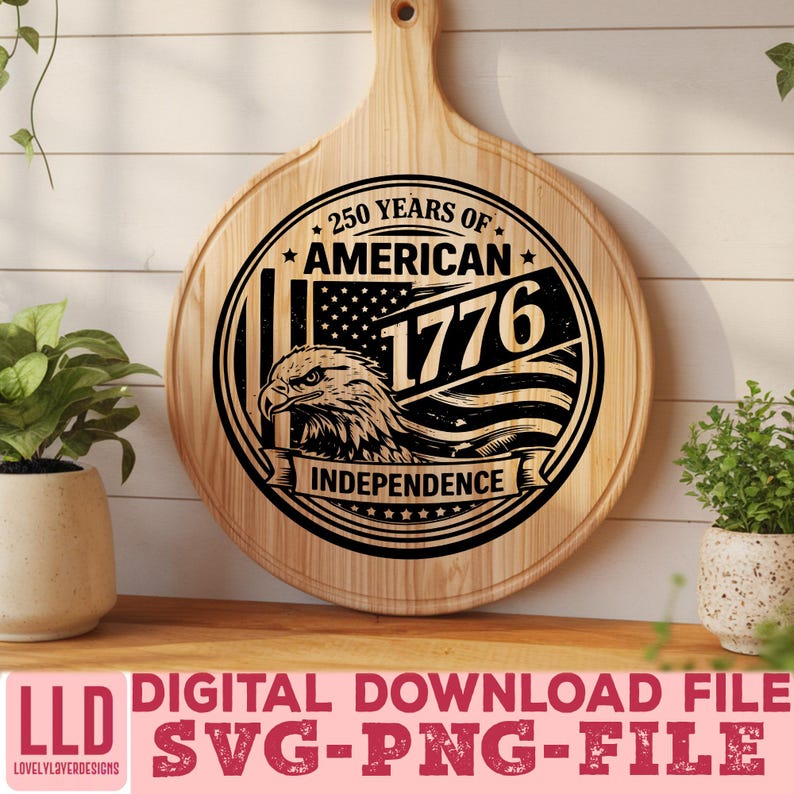 May include: A round wooden cutting board with a handle, featuring a black graphic design. The design includes an eagle, the American flag, and the text "250 Years of American Independence 1776". The bottom of the image has the text "DIGITAL DOWNLOAD FILE SVG-PNG-FILE".