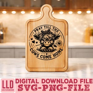 May include: A wooden cutting board with a handle, featuring a black and white illustration of a cow holding a flower, with the text "PRAY TILL THE COWS COME HOME." Below, the text reads "DIGITAL DOWNLOAD FILE SVG-PNG-FILE."