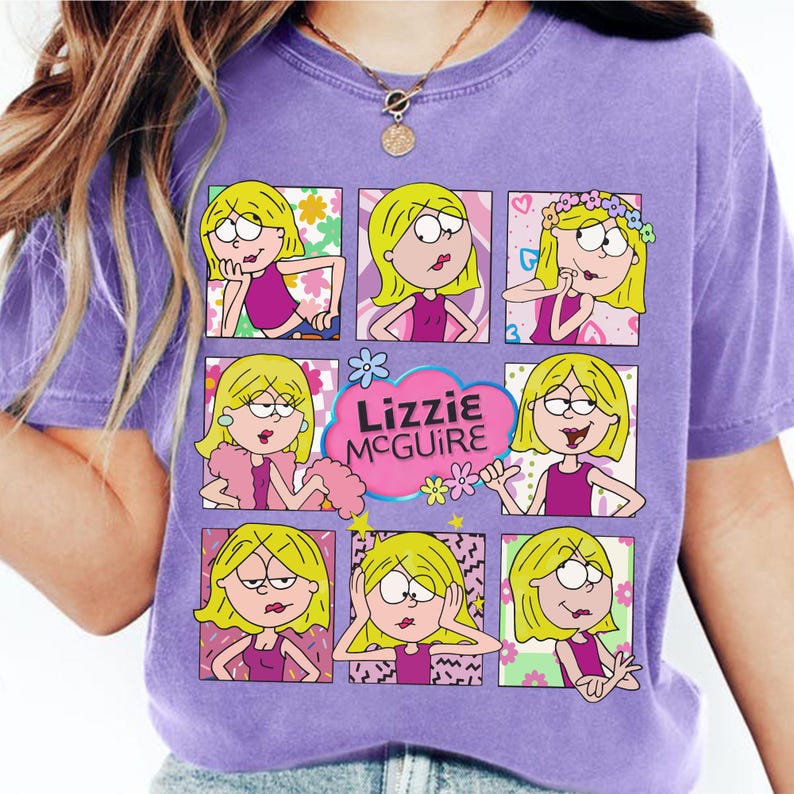 May include: A purple t-shirt featuring a grid of cartoon images of a blonde girl in various poses. The text "Lizzie McGuire" is in a pink cloud. The shirt has a crew neck and short sleeves.