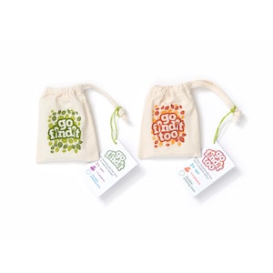 May include: Two off-white drawstring bags with the text "go find it" and "go find it too" in green and orange. Each bag has a matching tag with the game's details. The bags are designed for children aged 3+ and can accommodate 1-6 players.