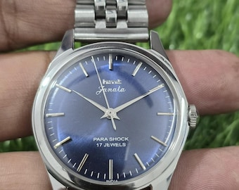 vintage Hmt Janata transparent dos à remontage manuel pour hommes en acier 17 rubis montre-bracelet