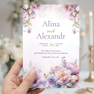 May include: A wedding invitation with floral watercolor design. The invitation features the names "Alina and Alexandr", date, time, and location. The design includes pink, purple, and peach flowers. The dress code is "Theme color".