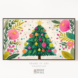 May include: A framed digital art print featuring a Christmas tree decorated with colorful ornaments and a gold star. The tree is surrounded by pink flowers and green foliage against a speckled background. The text "FRAME TV ART" is visible.