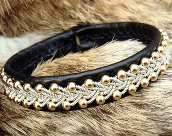 Sami bracelet | Scandinavian 14k gold cuff | SKINFAXE | Spun pewter | Reindeer leather | Antler closure