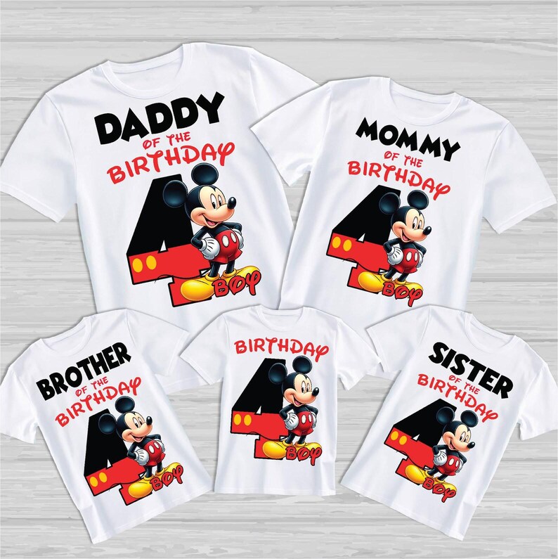 May include: White t-shirts featuring Mickey Mouse designs. Each shirt displays a large number 4, Mickey Mouse, and the word "Boy". The shirts also read "Daddy of the Birthday", "Mommy of the Birthday", "Brother of the Birthday", "Birthday", and "Sister of the Birthday".