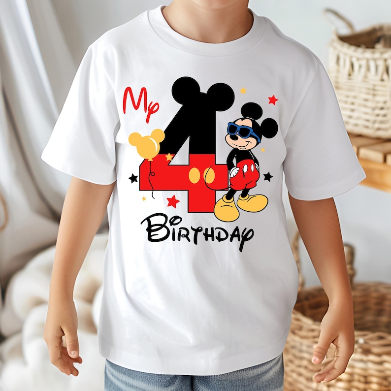 May include: White t-shirt featuring a colorful Mickey Mouse design for a fourth birthday. The design includes a large number 4, Mickey Mouse in sunglasses, the words "My Birthday", and star accents. The shirt is short-sleeved.