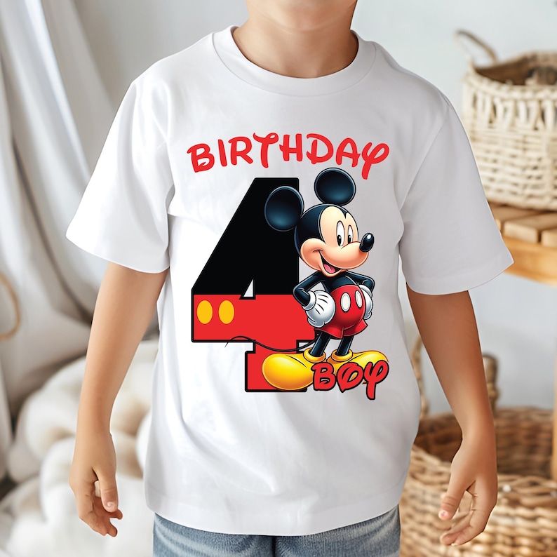 May include: White t-shirt with a Mickey Mouse graphic and the text "BIRTHDAY 4 BOY" in red. Mickey Mouse is in red shorts, yellow shoes, and white gloves. The number 4 is black with red and yellow accents.