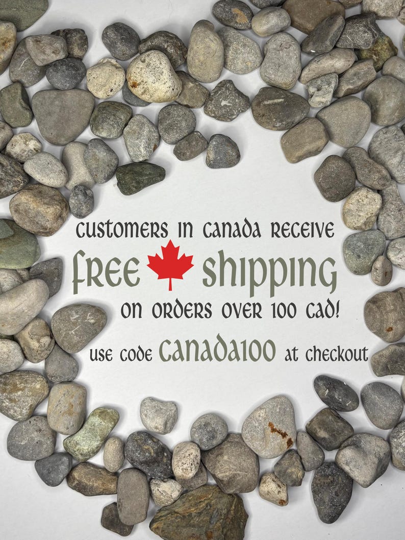 May include: A collection of smooth, multi-colored river stones arranged in a circular border around white space containing the text: CUSTOMERS IN CANADA RECEIVE free shipping ON ORDERS OVER 100 CAD! use code CANADA100 at checkout.