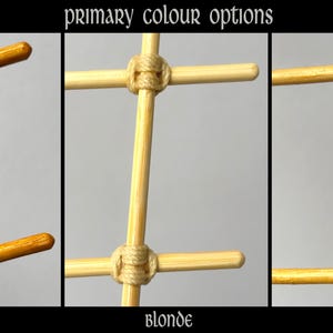 May include: A grid of wooden rods joined by cord, labeled primary colour options. The three variations are Garnet, featuring dark brown cord on golden wood; Blonde, with light beige cord on pale wood; and Amber, with tan cord on yellow wood.
