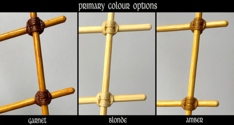May include: A grid of wooden rods joined by cord, labeled primary colour options. The three variations are Garnet, featuring dark brown cord on golden wood; Blonde, with light beige cord on pale wood; and Amber, with tan cord on yellow wood.