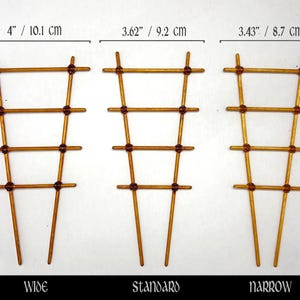 May include: Three wooden plant trellises labeled Wide, Standard, and Narrow. The wide trellis is 4 inches wide, the standard is 3.62 inches wide, and the narrow is 3.43 inches wide. All three trellises are 7.5 inches tall with four horizontal rungs.